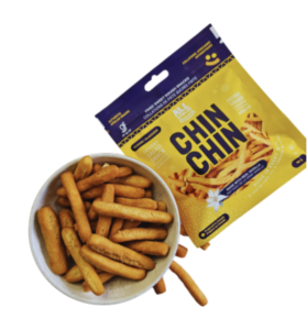 A white bowl filled with french fries shaped Chin Chin. Next to the bowl is All African Delights packet.